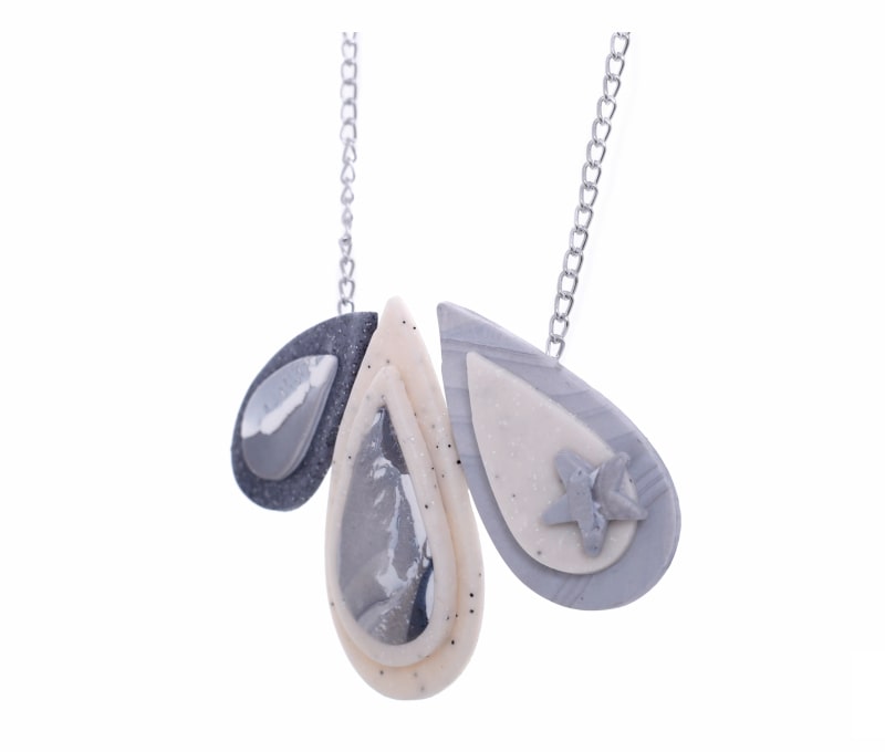 Attractive polymer clay necklace with three beautifully etched tear drop ornaments